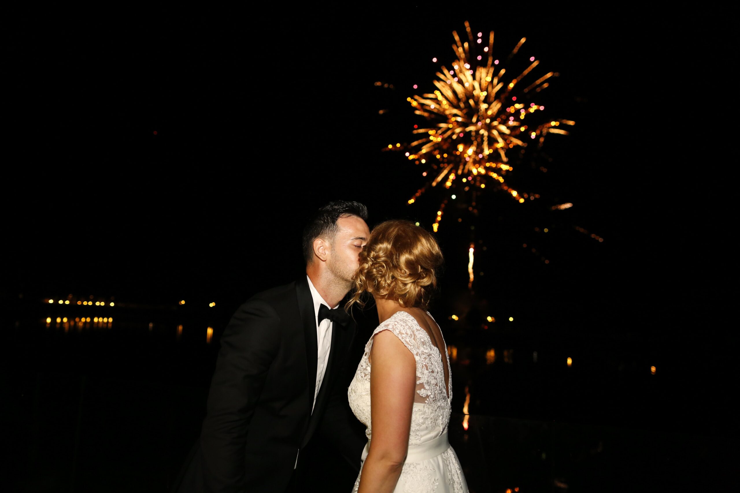couple admiring fireworks at wedding